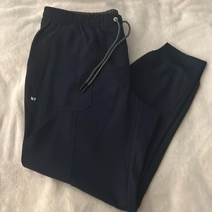 Woman’s Navy Koi next gen joggers and top. Never worn.